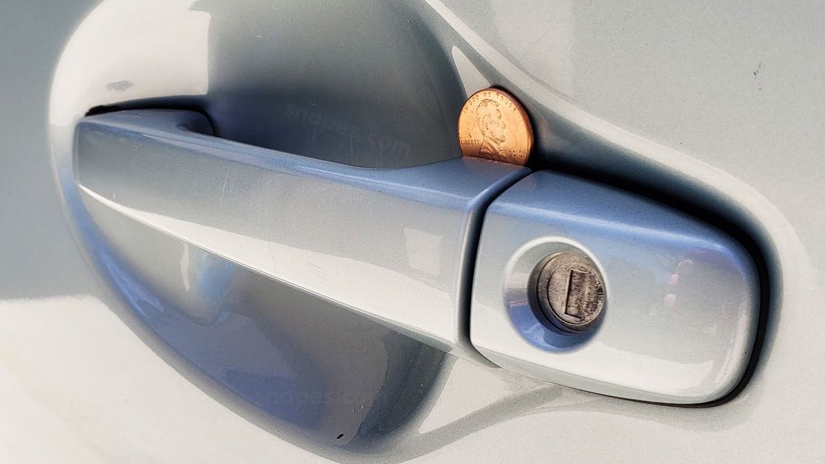 An online ad claimed If You See a Coin in Your Car Door Handle, Here's What It Means. (Snopes.com)