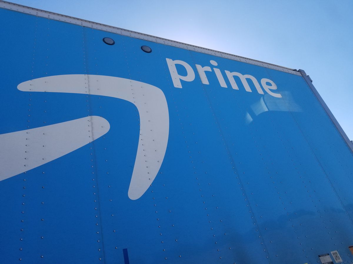 Low-angle view of the side of a blue tractor trailer semi truck with logo for Amazon Prime service, against a blue sky in San Ramon, California, October 8, 2018. (Photo by Smith Collection/Gado/Getty Images) (Smith Collection/Gado/Getty Images)
