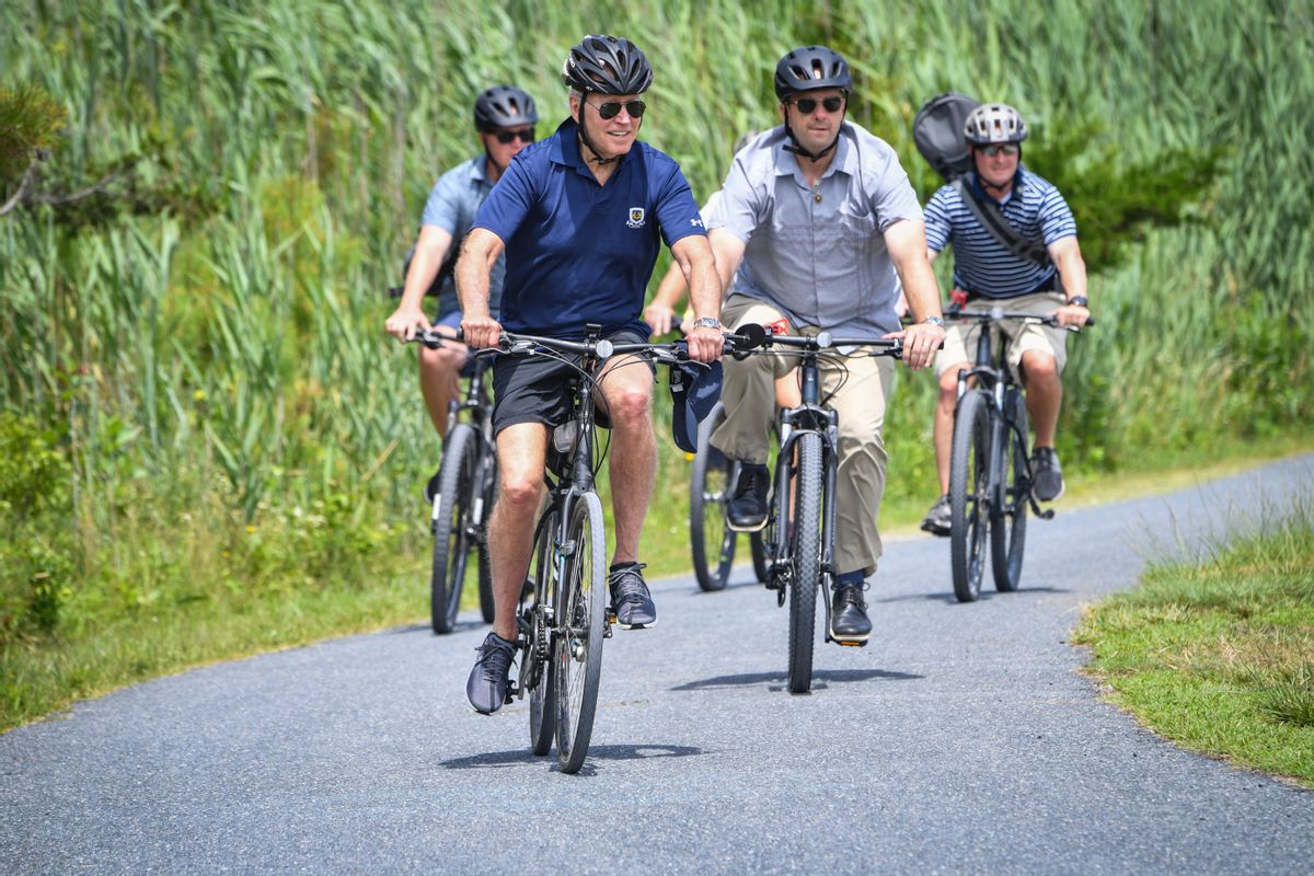 US President Joe Biden rides a bike through Gordon's Pond State Park in Rehoboth Beach, Delaware on July 10, 2022. (Photo by Nicholas Kamm / AFP) / The erroneous mention[s] appearing in the metadata of this photo by Nicholas Kamm has been modified in AFP systems in the following manner: [Rehoboth Beach] instead of [Rehobeth Beach]. Please immediately remove the erroneous mention[s] from all your online services and delete it (them) from your servers. If you have been authorized by AFP to distribute it (them) to third parties, please ensure that the same actions are carried out by them. Failure to promptly comply with these instructions will entail liability on your part for any continued or post notification usage. Therefore we thank you very much for all your attention and prompt action. We are sorry for the inconvenience this notification may cause and remain at your disposal for any further information you may require. (Photo by NICHOLAS KAMM/AFP via Getty Images) (NICHOLAS KAMM/AFP via Getty Images)