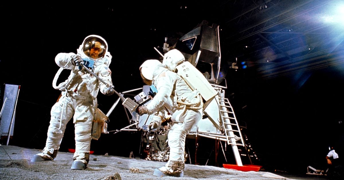 Two members of the Apollo 11 lunar landing mission participate in a simulation of deploying and using lunar tools, on the surface of the moon, during a training exercise. (Photo by: HUM Images/Universal Images Group via Getty Images) (Getty Images)