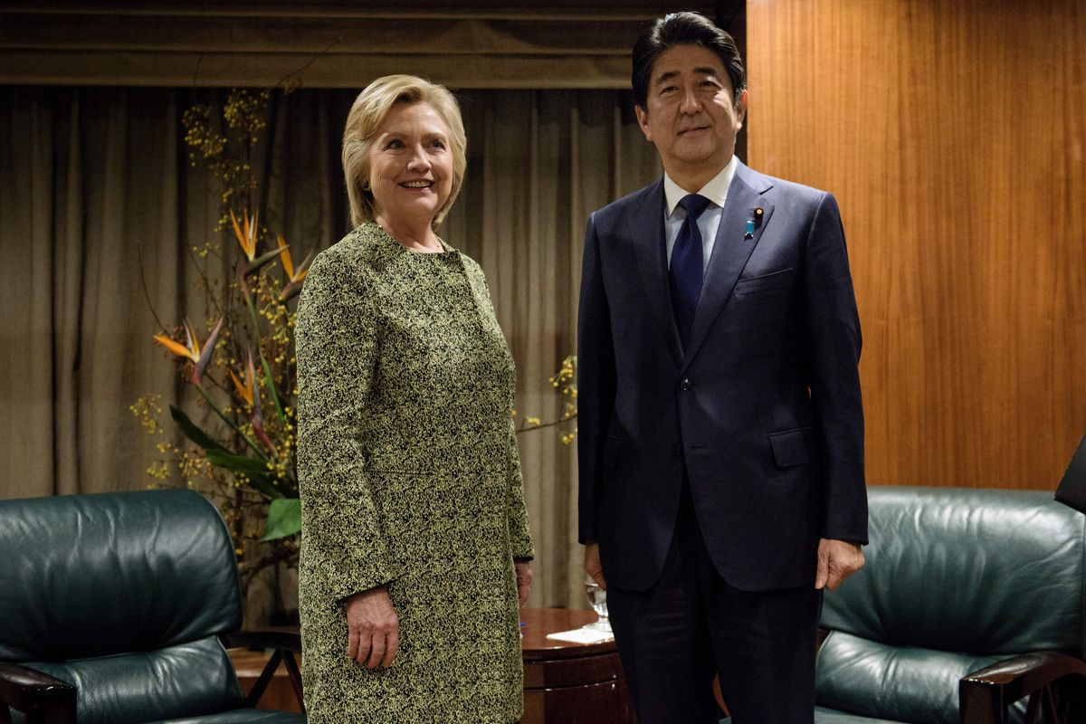 Democratic presidential nominee Hillary Clinton (L) stands with Japanese Prime Minister Shinzo Abe before a meeting at the Kitano Hotel on September 19, 2016 in New York. / AFP / Brendan Smialowski        (Photo credit should read BRENDAN SMIALOWSKI/AFP via Getty Images) (Getty Images)