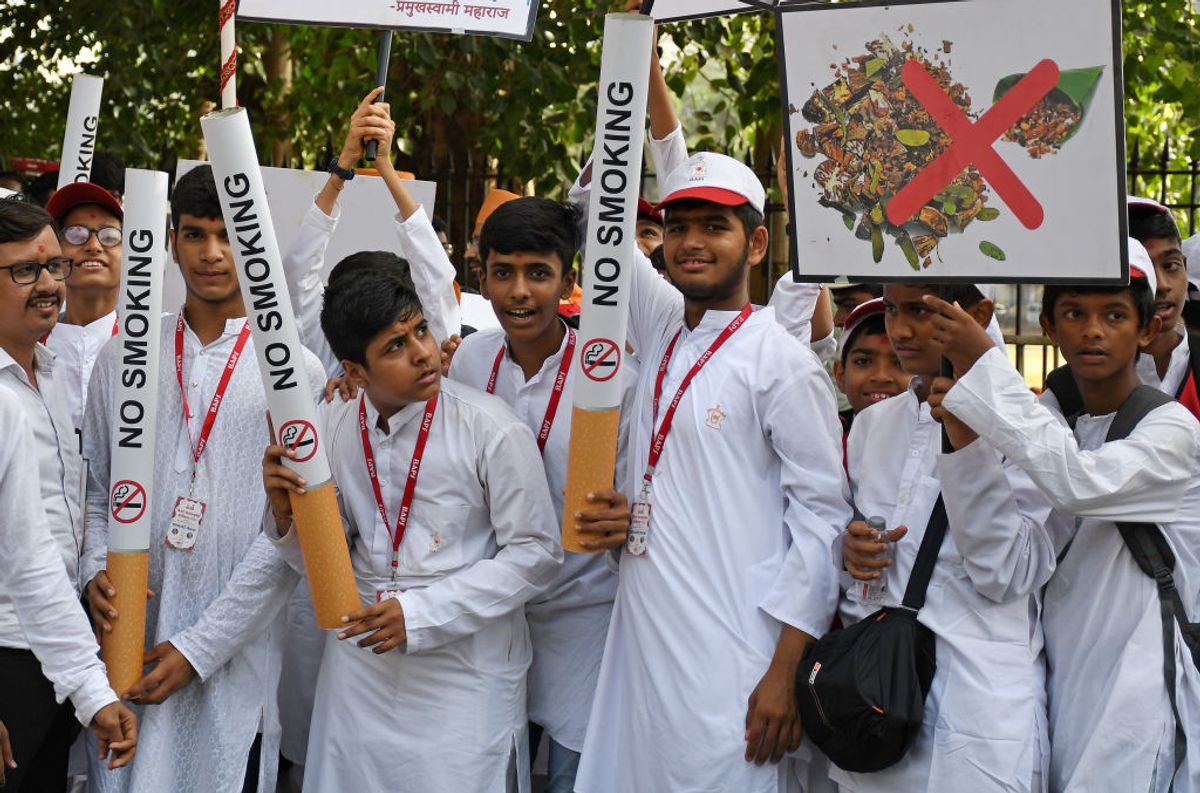 MUMBAI, MAHARASHTRA, INDIA - 2022/05/31: Children hold placards and replica of cigarette to spread awareness on the occasion of 'World No-Tobacco Day' in Mumbai. Every year on 31st May 'World No-Tobacco Day' campaign is held to spread awareness about the ill effects of tobacco on human beings. (Photo by Ashish Vaishnav/SOPA Images/LightRocket via Getty Images) (Getty Images)