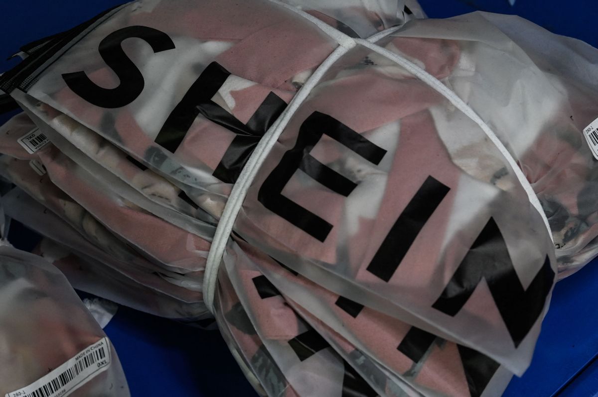 This picture shows signage of cross-border fast fashion e-commerce company SHEIN at a garment factory in Guangzhou, in Chinas southern Guangdong province on July 18, 2022. (Photo by Jade Gao / AFP) (Photo by JADE GAO/AFP via Getty Images) (Getty Images)