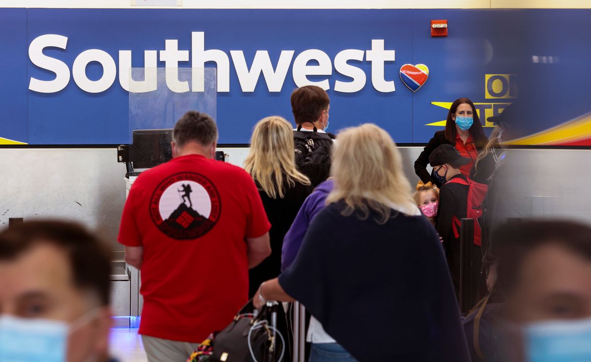 BALTIMORE, MARYLAND - OCTOBER 11: Travelers wait to check in at the Southwest Airlines ticketing counter at Baltimore Washington International Thurgood Marshall Airport on October 11, 2021 in Baltimore, Maryland. Southwest Airlines is working to catch up on a backlog after canceling hundreds of flights over the weekend, blaming air traffic control issues and weather. (Photo by Kevin Dietsch/Getty Images) (Kevin Dietsch/Getty Images)
