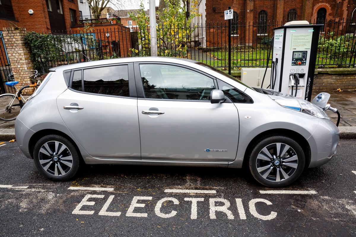 Go Ultra Low Nissan LEAF on charge on a London street. Ultra-low emission vehicles such as this can cost as little as 2p per mile to run and some electric cars and vans have a range of up to 700 miles. (Getty Images)