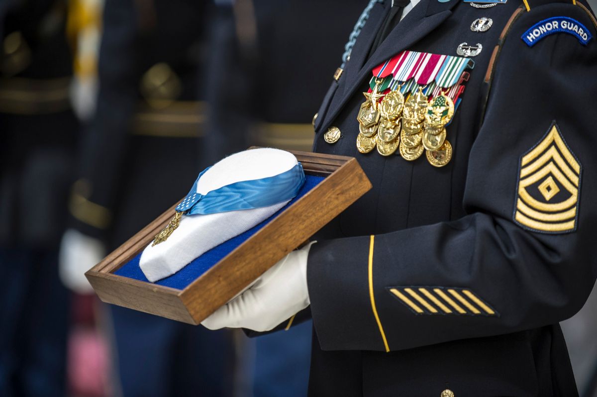 September 22, 2013 - U.S. Army Sergeant holds the Medal of Honor during an Enshrinement Ceremony at the Smithsonian National Postal Museum in Washington, D.C. (Stocktrek Images/Getty Images)