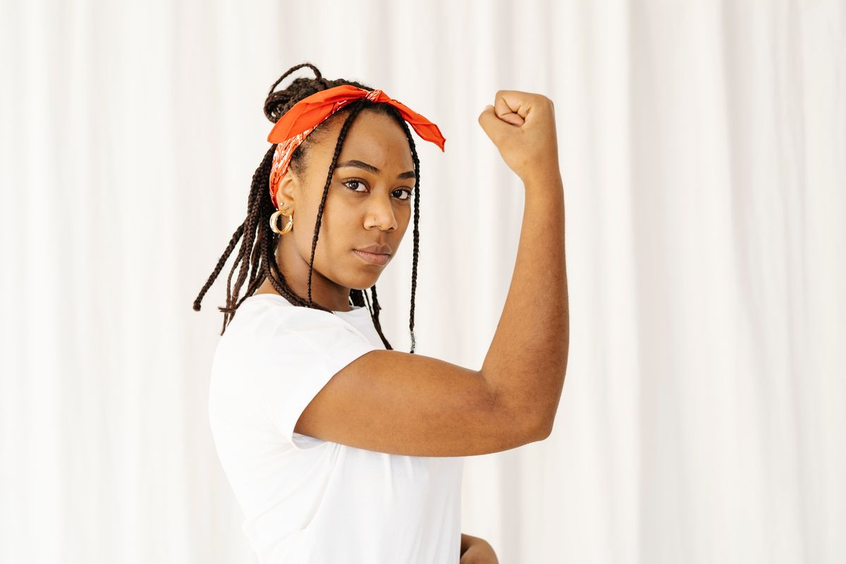 Side profile of woman showing her strength and muscle. female power and feminism concept. (Getty Images/Stock photo)