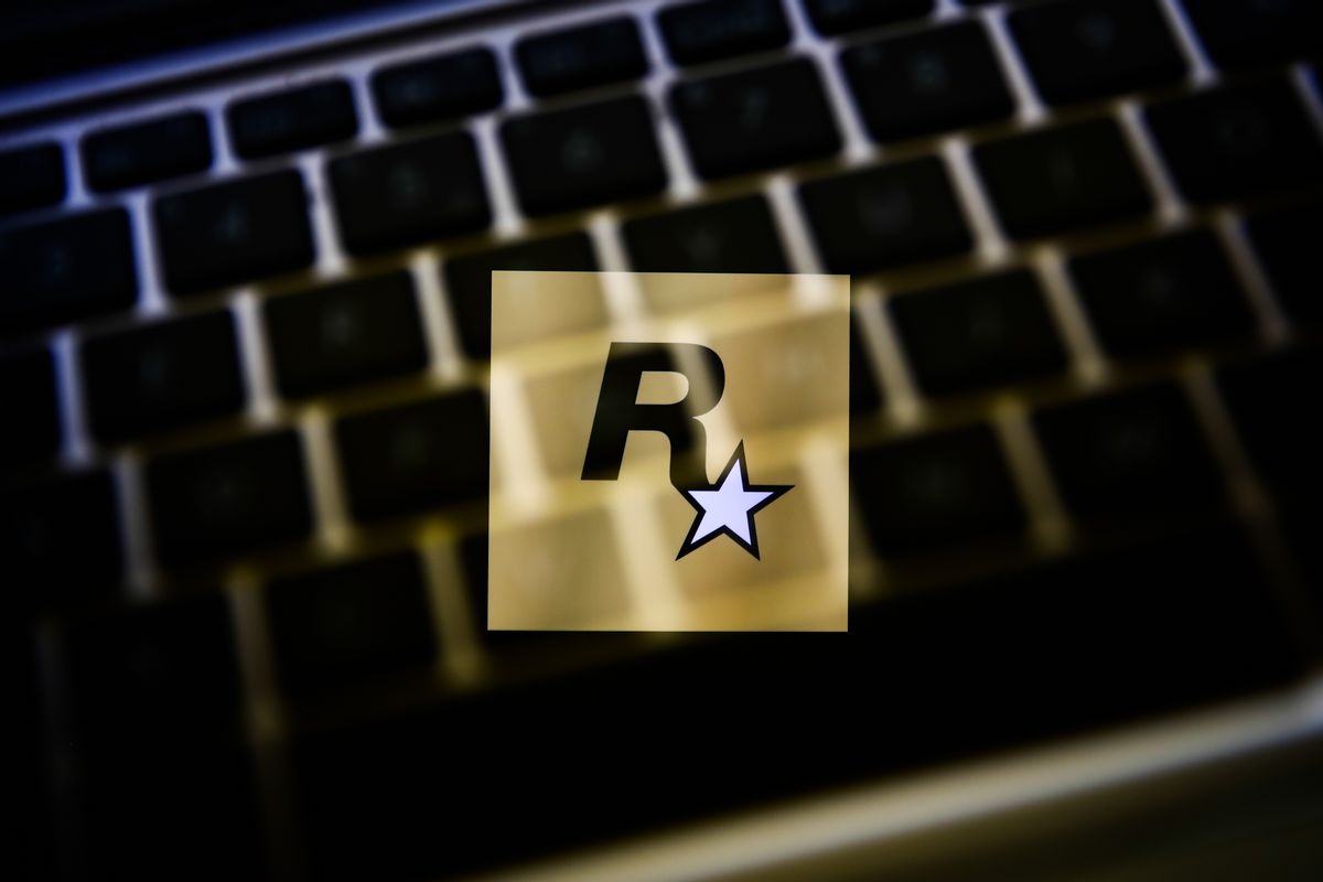 Rockstar Games logo displayed on a phone screen and a keyboard are seen in this multiple exposure illustration photo taken in Krakow, Poland on May 30, 2021. (Photo illustration by Jakub Porzycki/NurPhoto via Getty Images) (Jakub Porzycki/NurPhoto via Getty Images)