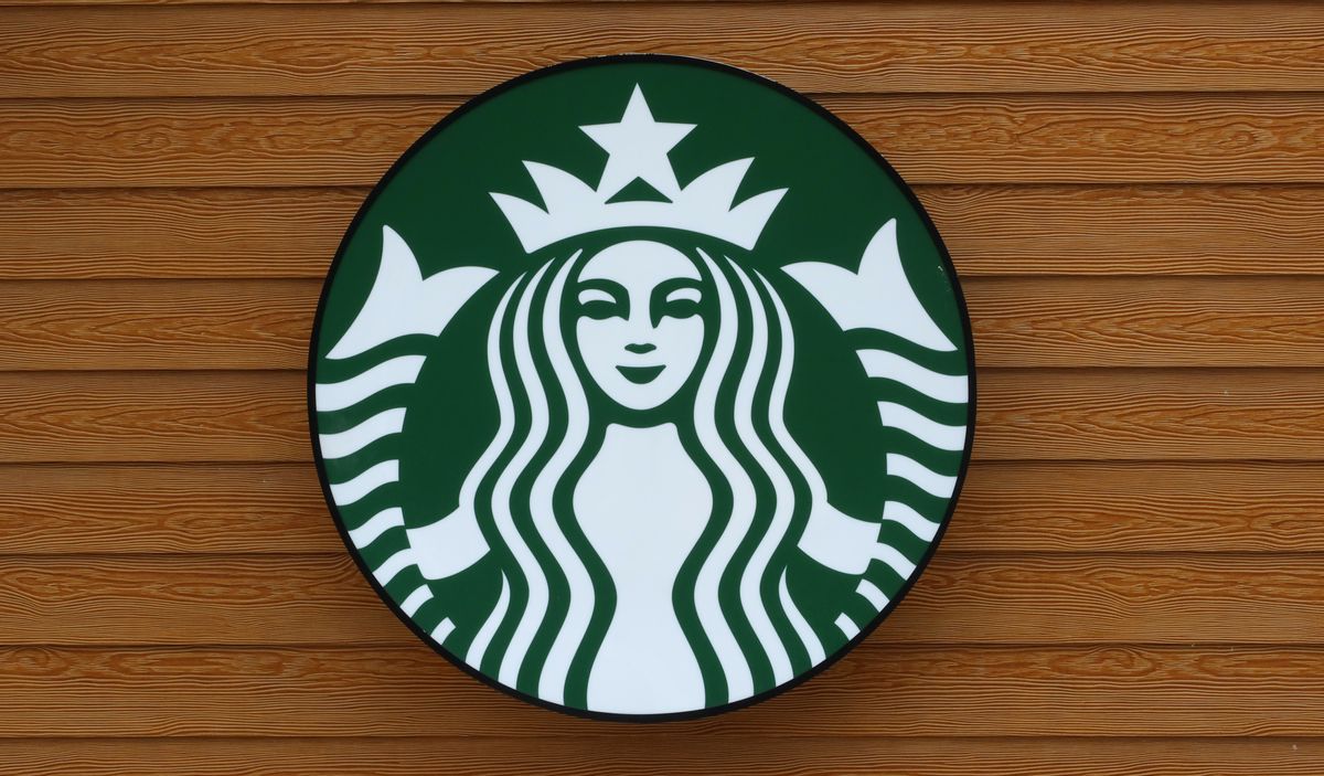 HALTON HILLS, ONT - JULY 1: A Starbucks logo hangs on a wall at the Toronto Premium Outlets shopping mall on July 1, 2022, in Halton Hills, Ontario. (Photo by Gary Hershorn/Getty Images) (Gary Hershorn/Getty Images)