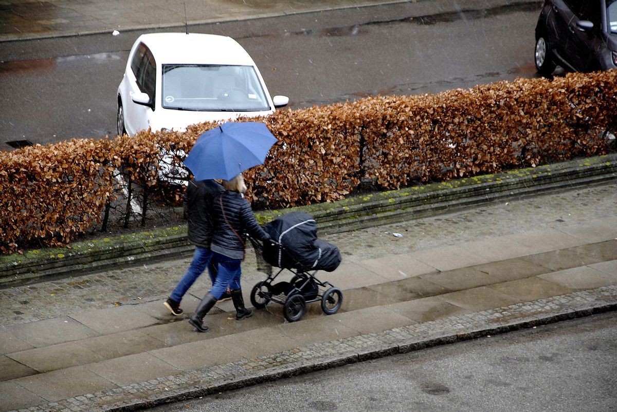 Kastrup.Copenhagen.Denamrk 31 March 2015 _Couple walks with baby pram and umbrella during rainy weather day (Photo by Francis Joseph Dean/Deanpictures) (Photo by Francis Dean/Corbis via Getty Images) (Getty Images)