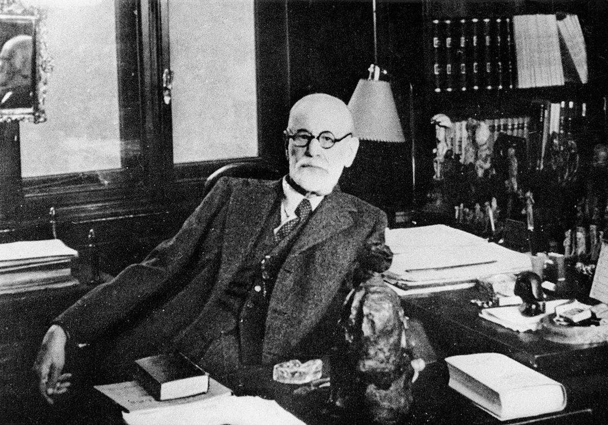 Portrait of Austrian psychologist Sigmund Freud (1856 - 1939) as he sits behind his desk in his study, Vienna, Austria, 1930s. The office is filled with figurines and statuettes of various origins. (Photo by Authenticated News/Getty Images) (Getty Images/Stock photo)