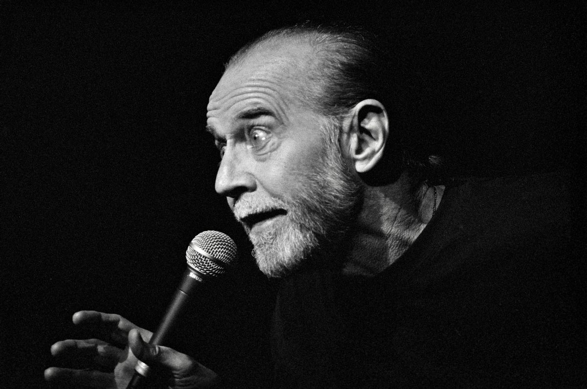CHEYENNE, WY – JUNE 1: George Denis Patrick Carlin performs a standup routine at the Cheyenne Civic Center on June 1, 1992 in Cheyenne, Wyoming. Carlin was born in New York City in 1937 and went from class clown to standout American comedian. His shtick was described as counterculture and there is no doubt that American culture and politics were favorite targets of Carlin’s satire. In 2017 Rolling Stone magazine ranked him second behind Richard Pryor among the 50 best stand-up comedians of all-time. Following his death in 2008 at the age of 71, George Carlin was posthumously awarded the Mark Twain Prize for American Humor. (Photo by Mark Junge/Getty Images) (Mark Junge/Getty Images)