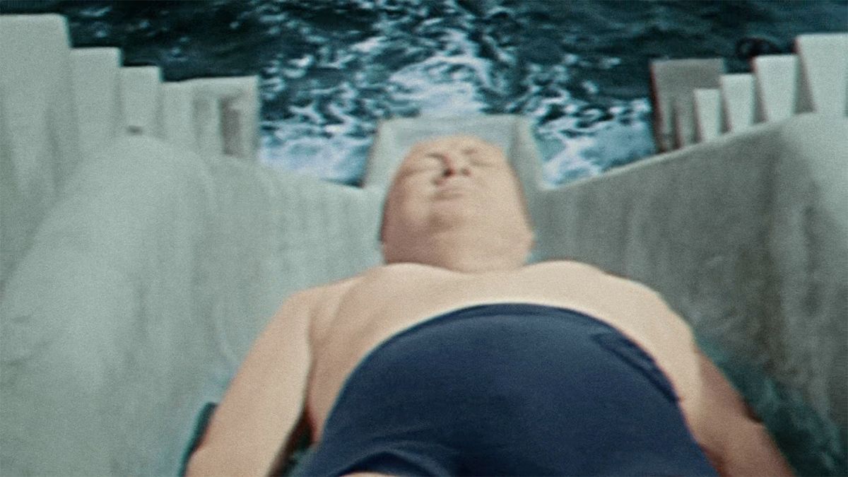 A video truly does show Winston Churchill losing his swimsuit after going backwards down a water slide. (Smithsonian Channel)
