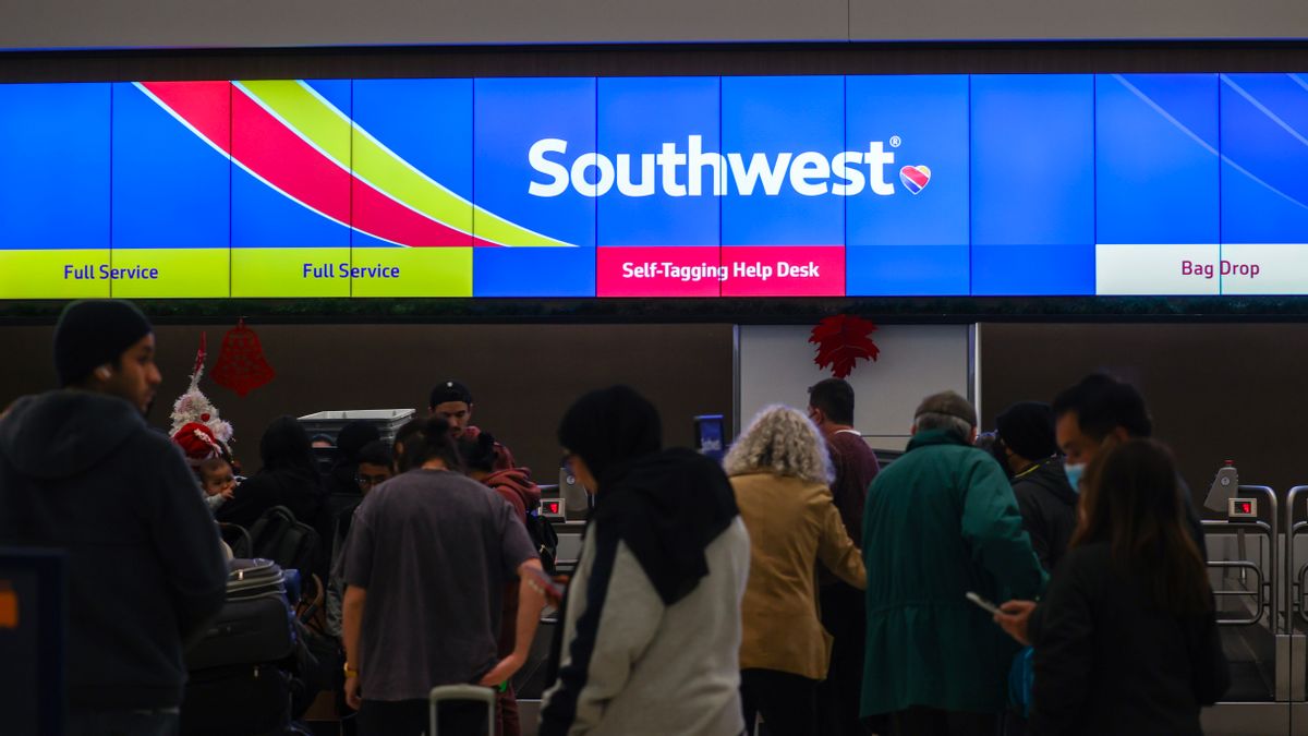 Passengers lined up by the Southwest Airlines counter at San Francisco International Airport (SFO) on Dec. 26, 2022, as Southwest cancels more than 2,800 U.S. flights on Monday amid fierce winter storms. (Photo by Tayfun Coskun/Anadolu Agency via Getty Images) (Tayfun Coskun/Anadolu Agency via Getty Images)