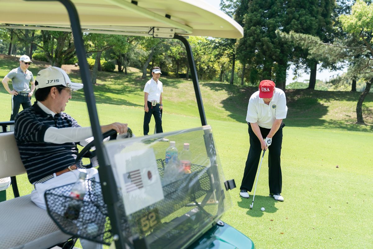 Japan Prime Minister Shinzo Abe watches President Donald J. Trump make a golf shot during their golf game Sunday, May 26, 2019, at the Mobara Country Club in Chiba, Japan. (The White House/Wikimedia Commons)