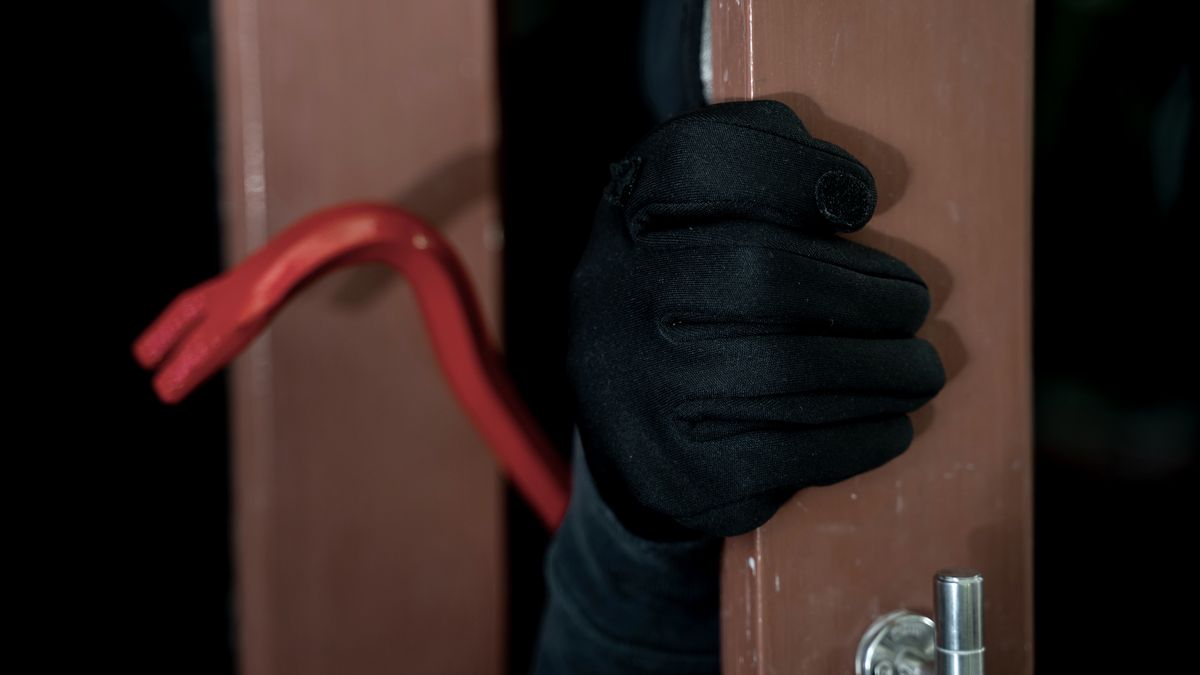 A stock photo of a burglar breaking into a home. (Seksan Mongkhonkhamsao/Getty Images)