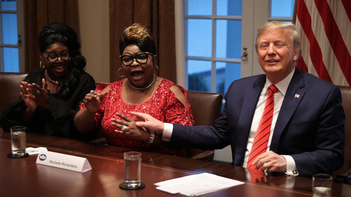 U.S. President Donald Trump (R) listens as Lynette 'Diamond' Hardaway (L) and Rochelle 'Silk' Richardson praise him during a news conference at the White House on Feb. 27, 2020 in Washington, D.C. (Photo by Chip Somodevilla/Getty Images) (Chip Somodevilla/Getty Images)