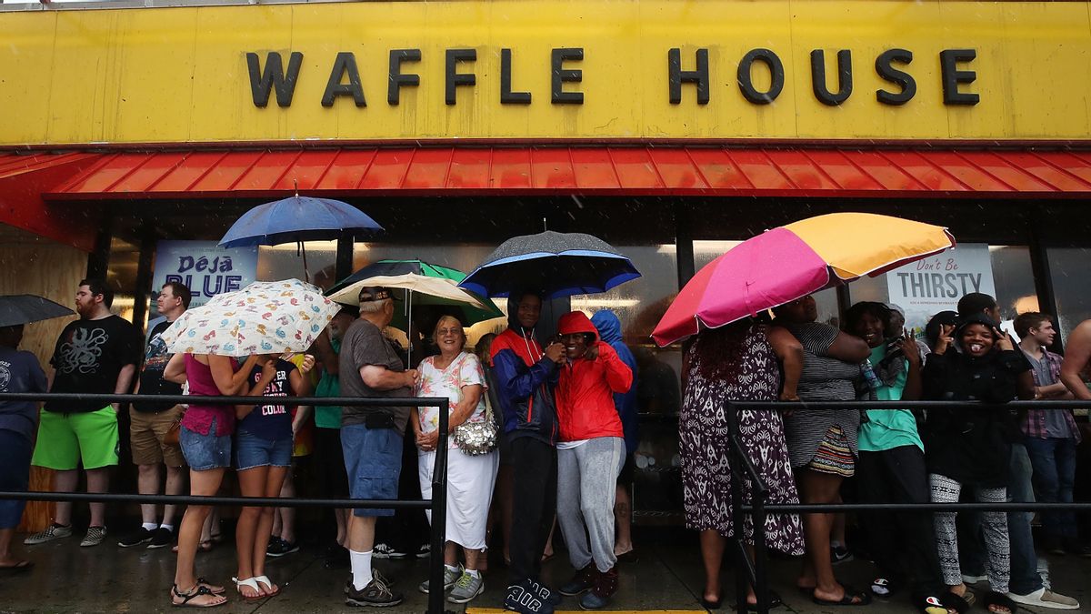 People wait in the rain to enter a Waffle House a day after Hurricane Florence hit the area, on September 15, 2018 in Wilmington, North Carolina. (Mark Wilson/Getty Images) (Mark Wilson/Getty Images)