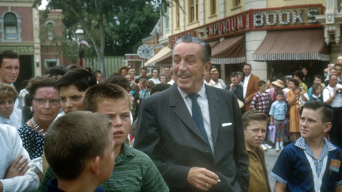 American film producer and studio executive Walt Disney (1901-1966) stands with a group of boys and others as they wait for a parade on Main Street, USA at Disneyland in Anaheim, California in August 1962. (Photo by Tom Nebbia/Corbis via Getty Images) (Tom Nebbia/Corbis via Getty Images)