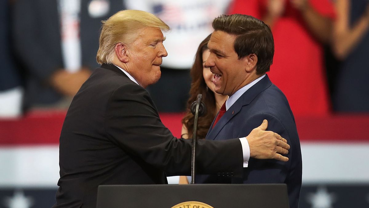 U.S. President Donald Trump greets Florida Republican gubernatorial candidate Ron DeSantis during a campaign rally on Oct. 31, 2018 in Estero, Florida. (Photo by Joe Raedle/Getty Images) (Joe Raedle/Getty Images)