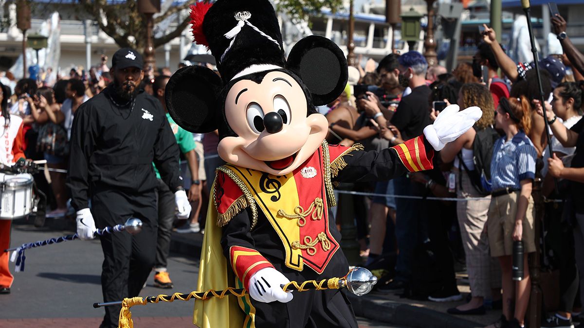 Mickey Mouse waves to fans during a parade at Walt Disney World Resort on March 03, 2022 in Lake Buena Vista, Florida. (Photo by Arturo Holmes/Getty Images for Disney Dreamers Academy) (Arturo Holmes/Getty Images for Disney Dreamers Academy)