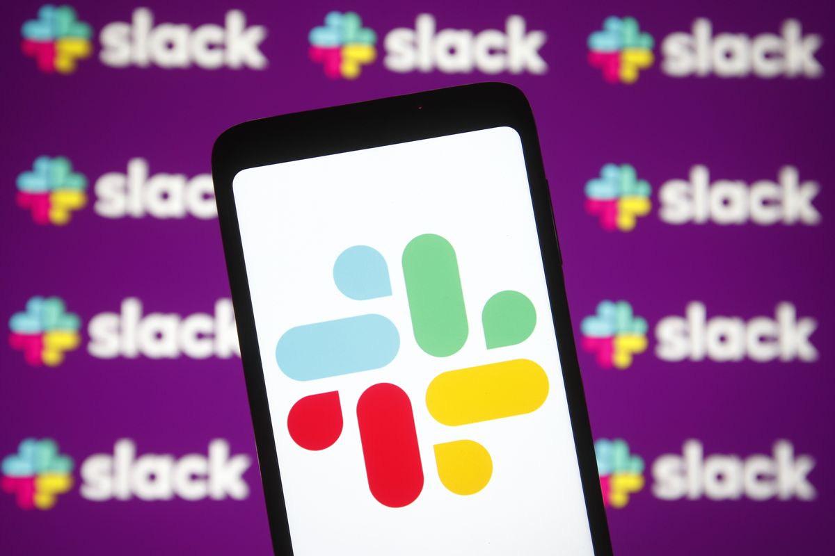 In this photo illustration a Slack logo of a business communication platform is seen on a smartphone and a pc screen. (Photo Illustration by Pavlo Gonchar/SOPA Images/LightRocket via Getty Images) (Pavlo Gonchar/SOPA Images/LightRocket via Getty Images)