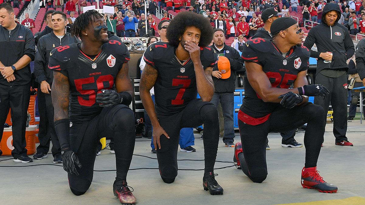 Eli Harold #58, Colin Kaepernick #7 and Eric Reid #35 of the San Francisco 49ers kneel in protest during the national anthem prior to their NFL game against the Arizona Cardinals at Levi's Stadium on Oct. 6, 2016 in Santa Clara, California. (Photo by Thearon W. Henderson/Getty Images) (Thearon W. Henderson/Getty Images)