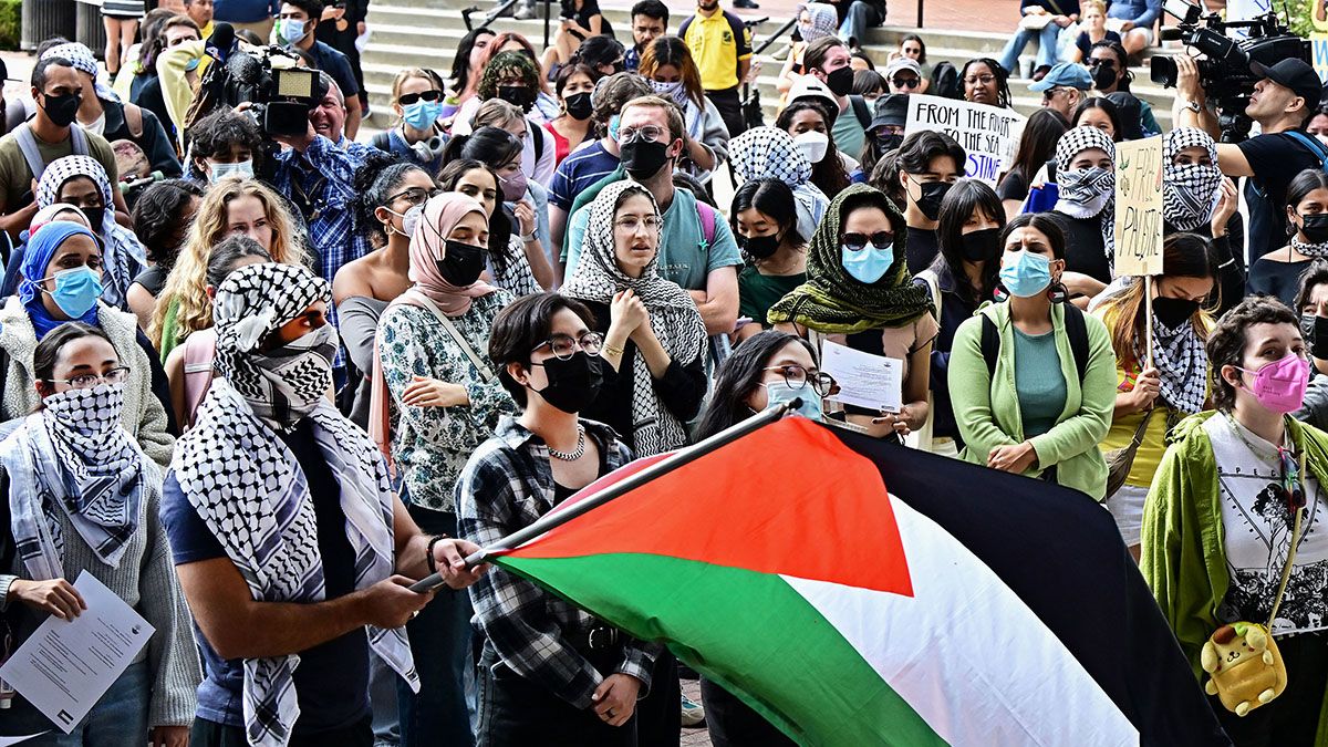 A person holds a Palestinian flag as students participate in a "Walkout to Fight Genocide and Free Palestine" at Bruin Plaza at UCLA (University of California, Los Angeles) in Los Angeles on Oct. 25, 2023. (Photo by FREDERIC J. BROWN/AFP via Getty Images) (FREDERIC J. BROWN/AFP via Getty Images)