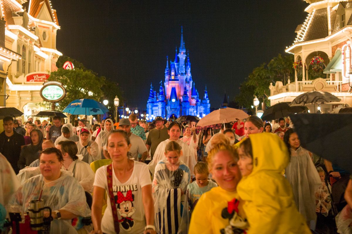 Tourists leave after a stunning firework show at the Magic Kingdom Park in Walt Disney World Resort on July 1, 2021 in Lake Buena Vista, Florida. The firework show in Disney World was suspended for one year due to the pandemic. ( Liao Pan/China News Service via Getty Images)