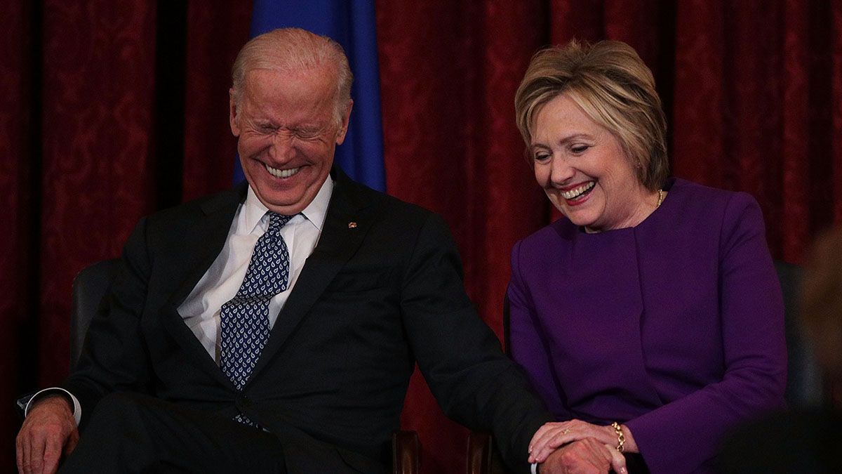 Former U.S. Secretary of State Hillary Clinton shares a moment with Vice President Joe Biden on Dec. 8, 2016 in Washington, D.C. (Photo by Alex Wong/Getty Images) (Alex Wong/Getty Images)