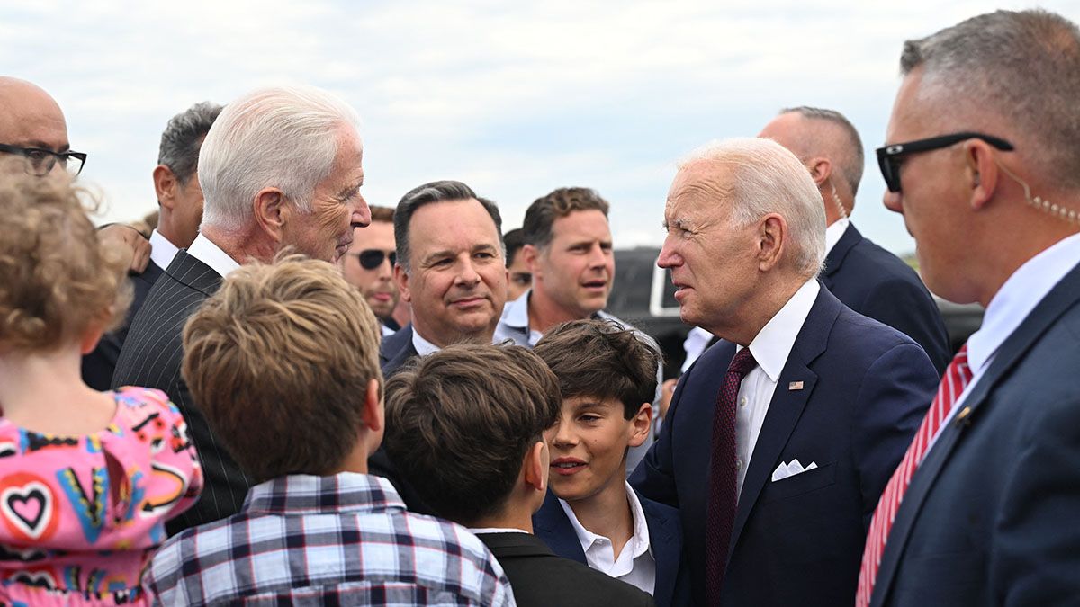 U.S. President Joe Biden talks to U.S. ambassador to Finland Douglas Hickey and embassy staff before boarding Air Force One at the Helsinki airport in Finland on July 13, 2023. (Photo by ANDREW CABALLERO-REYNOLDS/AFP via Getty Images) (ANDREW CABALLERO-REYNOLDS/AFP via Getty Images)