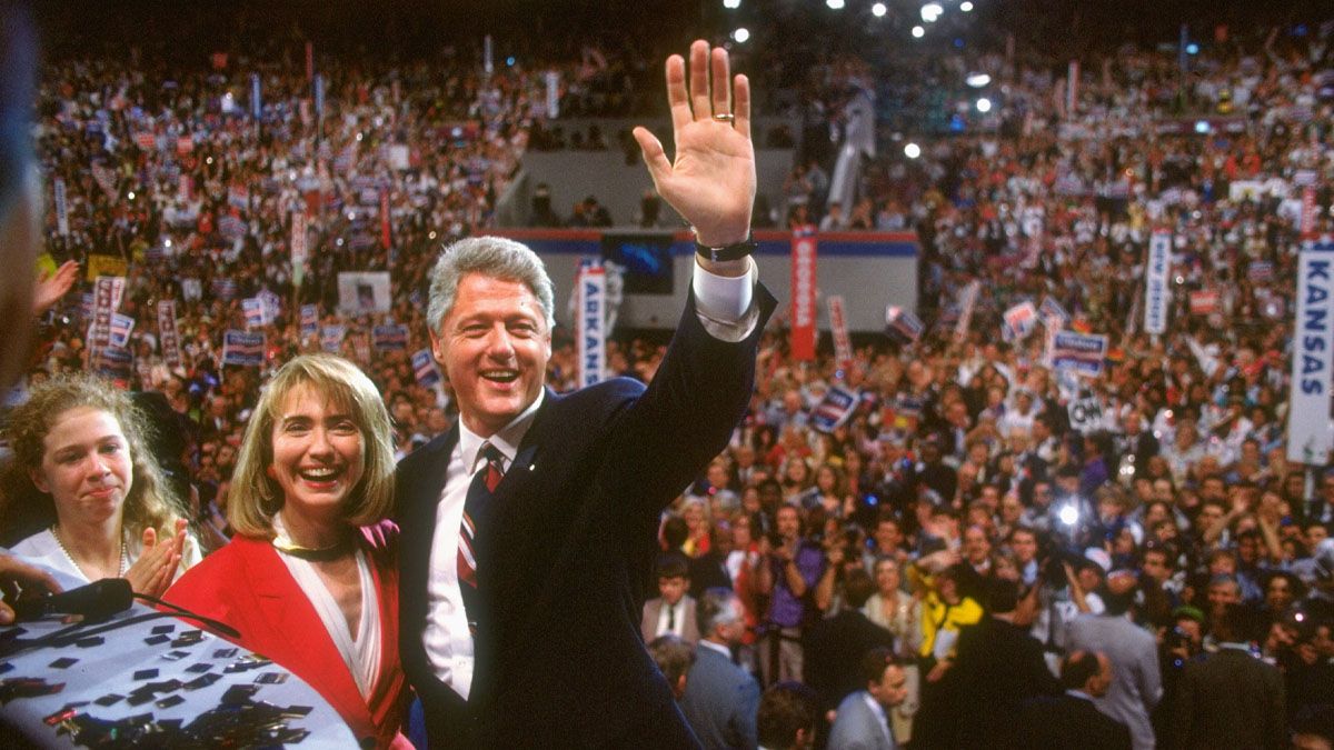 Democratic Party presidential nominee Bill Clinton waving to crowd on floor of Democratic Natl. Convention, wife Hillary Rodham Clinton and daughter Chelsea by his side, in 1992. (Photo by Steve Liss/Getty Images) (Steve Liss/Getty Images)