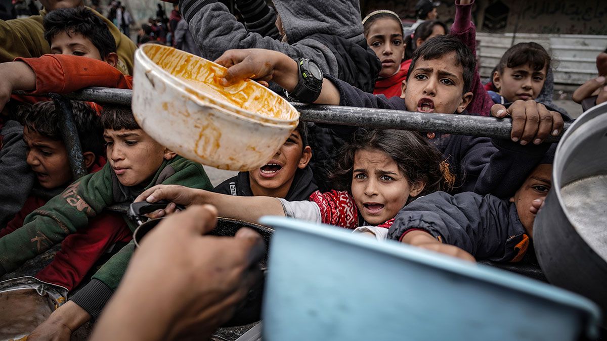 Palestinian children wait in line for food after being displaced due to Israeli attacks, in Rafah, Gaza, on Feb. 10, 2024. (Photo by Belal Khaled/Anadolu via Getty Images) (Belal Khaled/Anadolu via Getty Images)