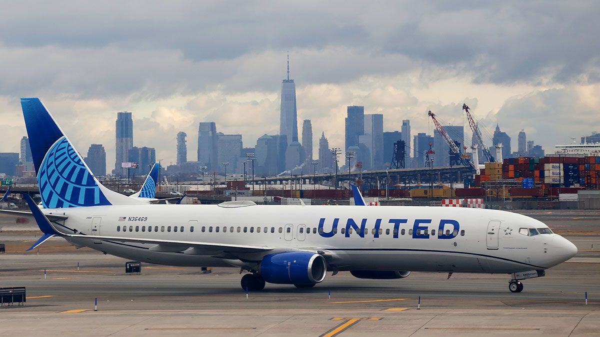 A United Airlines airplane proceeds to a gate at Newark Liberty International Airport in front of the skyline of lower Manhattan and One World Trade Center in New York City on Jan. 27, 2024, in Newark, New Jersey. (Photo by Gary Hershorn/Getty Images) (Gary Hershorn/Getty Images)