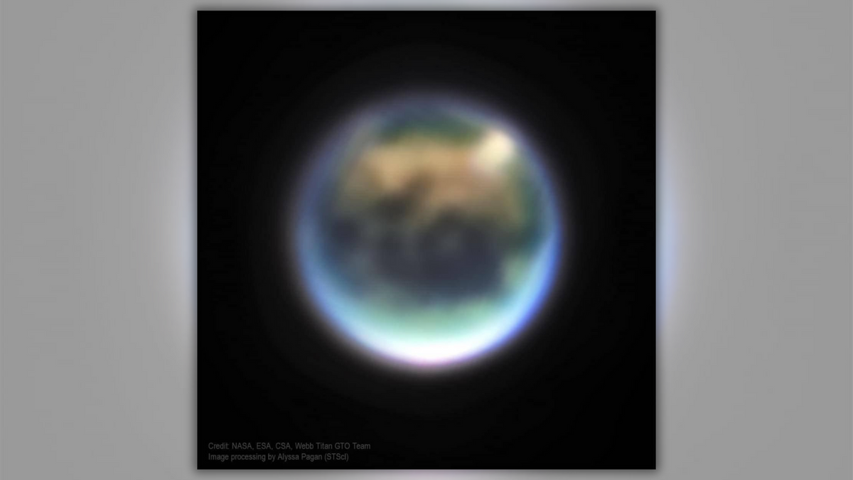 The blurry photo shows a celestial body that looks similar to Earth. (NASA, ESA, CSA, W. M. Keck Observatory, A. Pagan (STScI))