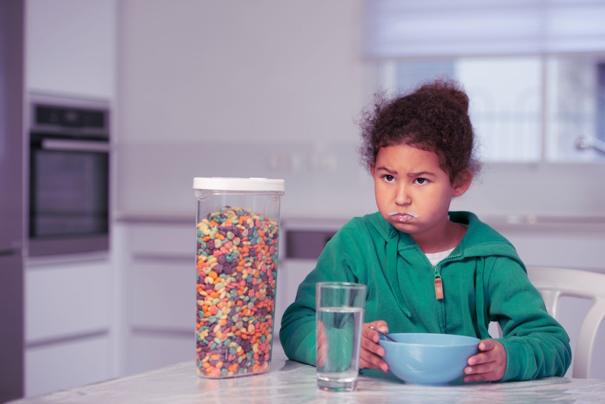 A child eats sugary cereals. ( Getty Images)