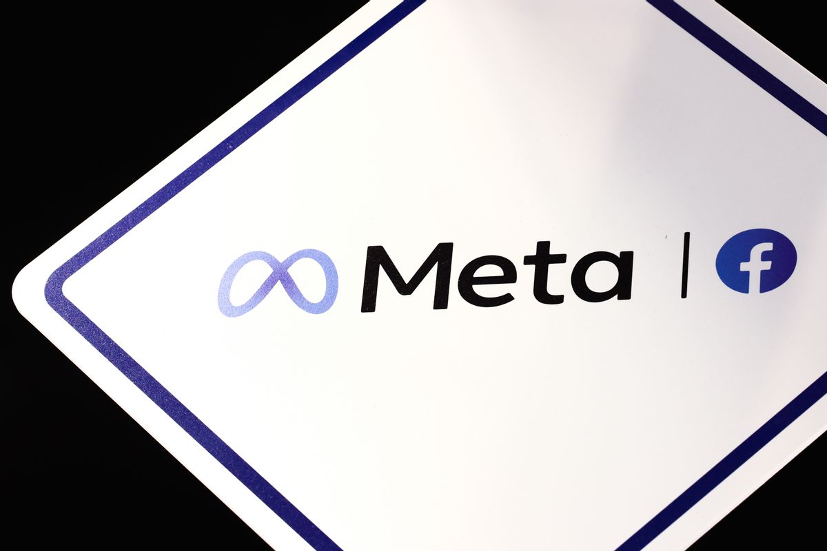 A sign shows the logo for Meta. On one side of the word is an infinity loop, while on the other side is the logo for Facebook, a white f inside a blue circle.  Getty Images