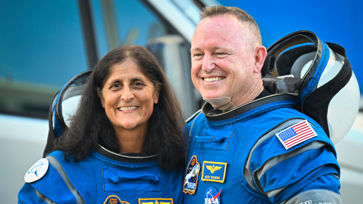 Butch Wilmore (R) and Suni Williams (L) leave Kennedy Space Center to board the Boeing CST-100 Starliner spacecraft on June 5, 2024.  (Getty Images)