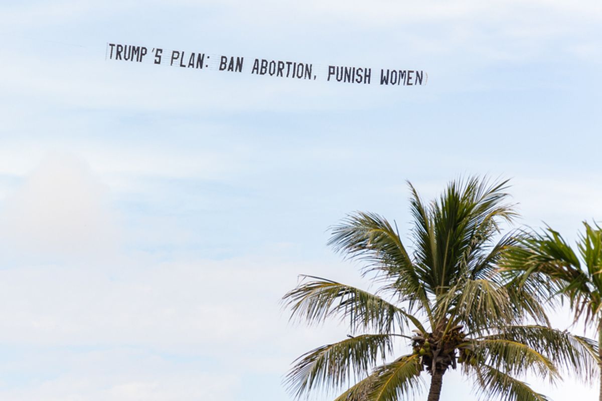 The Democratic National Committee flies a banner over Donald Trump's Mar-A-Lago resort on May 1, 2024, in Palm Beach, Florida. (Getty Images)