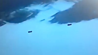 A tweet claimed to show a video recorded by NASA of aliens flying two rectangular UFOs.
