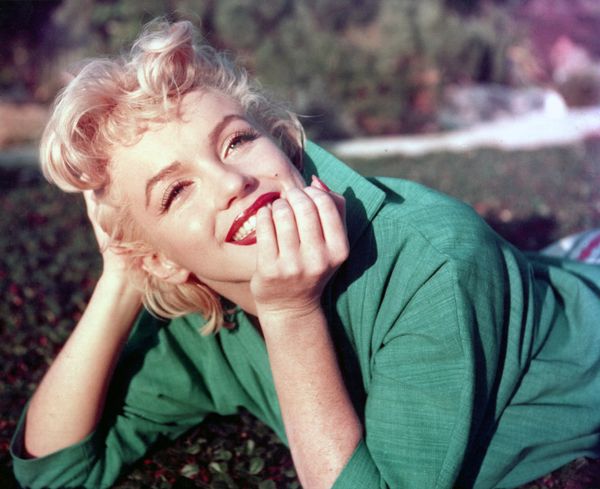 PALM SPRINGS, CA - 1954: Actress Marilyn Monroe poses for a portrait laying on the grass in 1954 in Palm Springs, California. (Photo by Baron/Getty Images) (Baron/Getty Images)