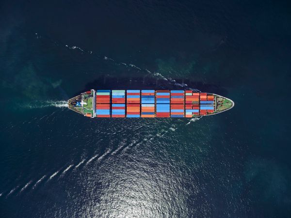 Aerial view of cargo ship, cargo container in warehouse harbor at thailand . (Getty Images)