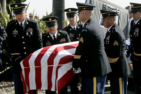 SAN DIEGO - FEBRUARY 2:  Military Honor Guard members carry a coffing with Capt. Brian Freeman during a memorial service at Ft. Rosecrans National Cemetery on February 2, 2007 in San Diego, California.  Army Captain Freeman, 31, a West Point graduate and star athlete, reportedly told Senators Chris Dodd, (D-CT) and John Kerry (D-MA) over a month ago in Baghdad, that the war was going badly before being killed by gunfire and grenades on January 20 while serving in Iraq.  (Photo by Sandy Huffaker/Getty Images) (Getty Images)