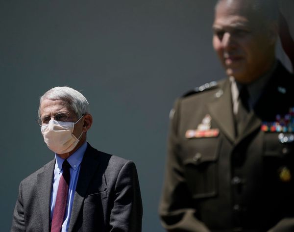 WASHINGTON, DC - MAY 15: Dr. Anthony Fauci, director of the National Institute of Allergy and Infectious Diseases listens to President Donald Trump speak about coronavirus vaccine development in the Rose Garden of the White House on May 15, 2020 in Washington, DC. Dubbed "Operation Warp Speed," the Trump administration is announcing plans for an all-out effort to produce and distribute a coronavirus vaccine by the end of 2020. (Photo by Drew Angerer/Getty Images) (Getty Images)