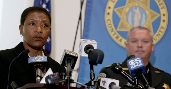 Contra Costa County District Attorney Diana Becton speaks as Pittsburg Police Chief Brian Addington looks on during a news conference announcing the arrest of eight suspected gang members at their office in Martinez, Calif., on Wednesday, Dec. 20, 2017. A joint operation between the Contra Costa County District Attorney, Pittsburg Police and the Federal Bureau of Investigation and other law enforcement agencies to curb gang violence lead to the arrests. (Anda Chu/Bay Area News Group) (Photo by MediaNews Group/Bay Area News via Getty Images) (MediaNews Group/Bay Area News via Getty Images)