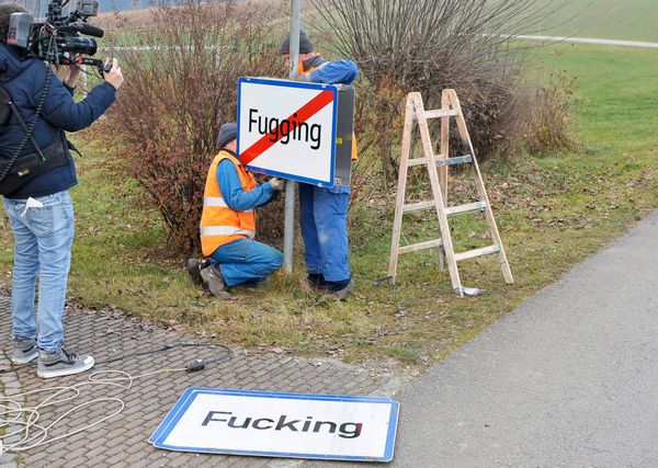 Workers exchange the town sign of Fucking, from now Fugging, on December 2, 2020 in Fucking, some 35 km North of Salzburg, Austria. - Residents of an Austrian village will ring in the new year 2021 under a new name -- Fugging -- after ridicule, especially on social media, became too much to bear. They finally grew weary of Fucking. (Photo by MANFRED FESL / APA / AFP) / Austria OUT (Photo by MANFRED FESL/APA/AFP via Getty Images) (MANFRED FESL/APA/AFP via Getty Images)