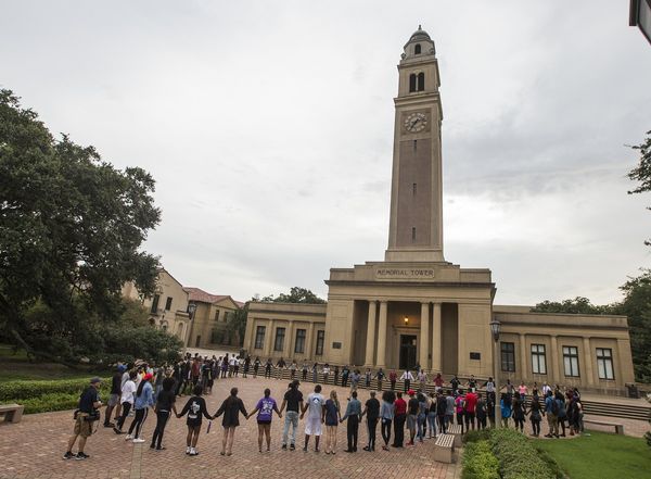 BATON ROUGE, LA -JULY 11:  Students gather at a prayer vigil for Alton Sterling at the Memorial Tower on the Louisiana State University campus July 11, 2016 in Baton Rouge, Louisiana. Sterling was shot by a police officer in front of the Triple S Food Mart in Baton Rouge on July 5th, leading the Department of Justice to open a civil rights investigation. (Photo by Mark Wallheiser/Getty Images)