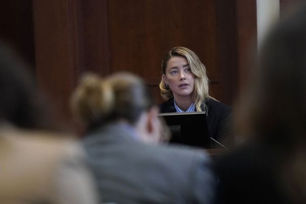 Actor Amber Heard testifies at Fairfax County Circuit Court during a defamation case against her by ex-husband, actor Johnny Depp in Fairfax, Virginia, on May 4, 2022. - US actor Johnny Depp sued his ex-wife Amber Heard for libel in Fairfax County Circuit Court after she wrote an op-ed piece in The Washington Post in 2018 referring to herself as a "public figure representing domestic abuse." (Photo by ELIZABETH FRANTZ / POOL / AFP) (Photo by ELIZABETH FRANTZ/POOL/AFP via Getty Images) (ELIZABETH FRANTZ/POOL/AFP via Getty Images)