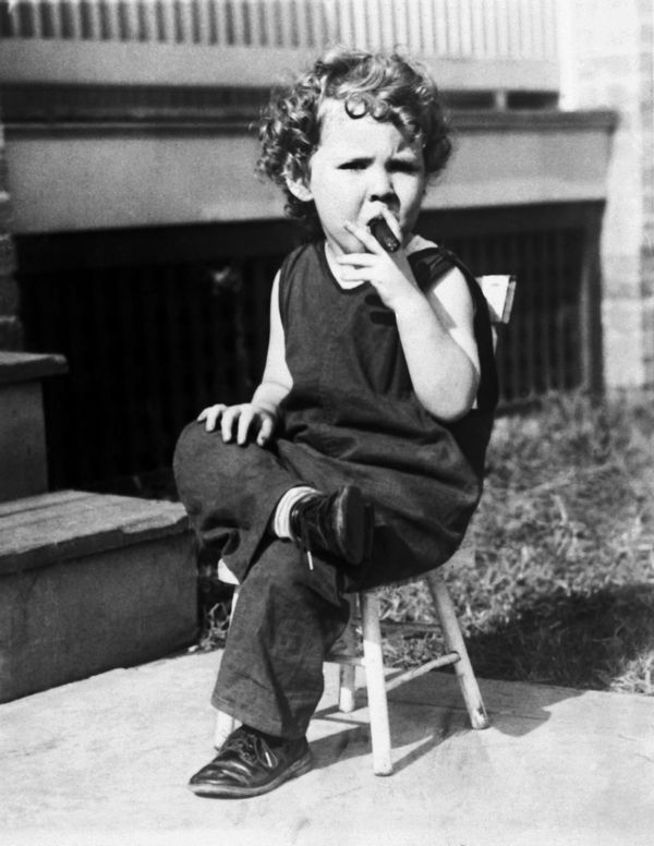 Child smoking a cigar